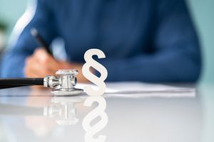 Paragraph symbol and stethoscope