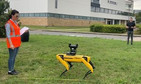 Four-legged, dog-like robot walks across the lawn