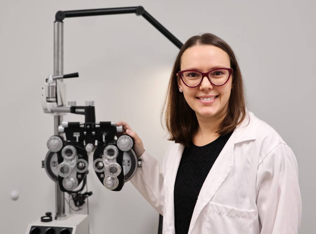 Patient smiling after her eye appointment with her local eye doctor