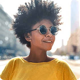 woman smiling wearing sunglasses